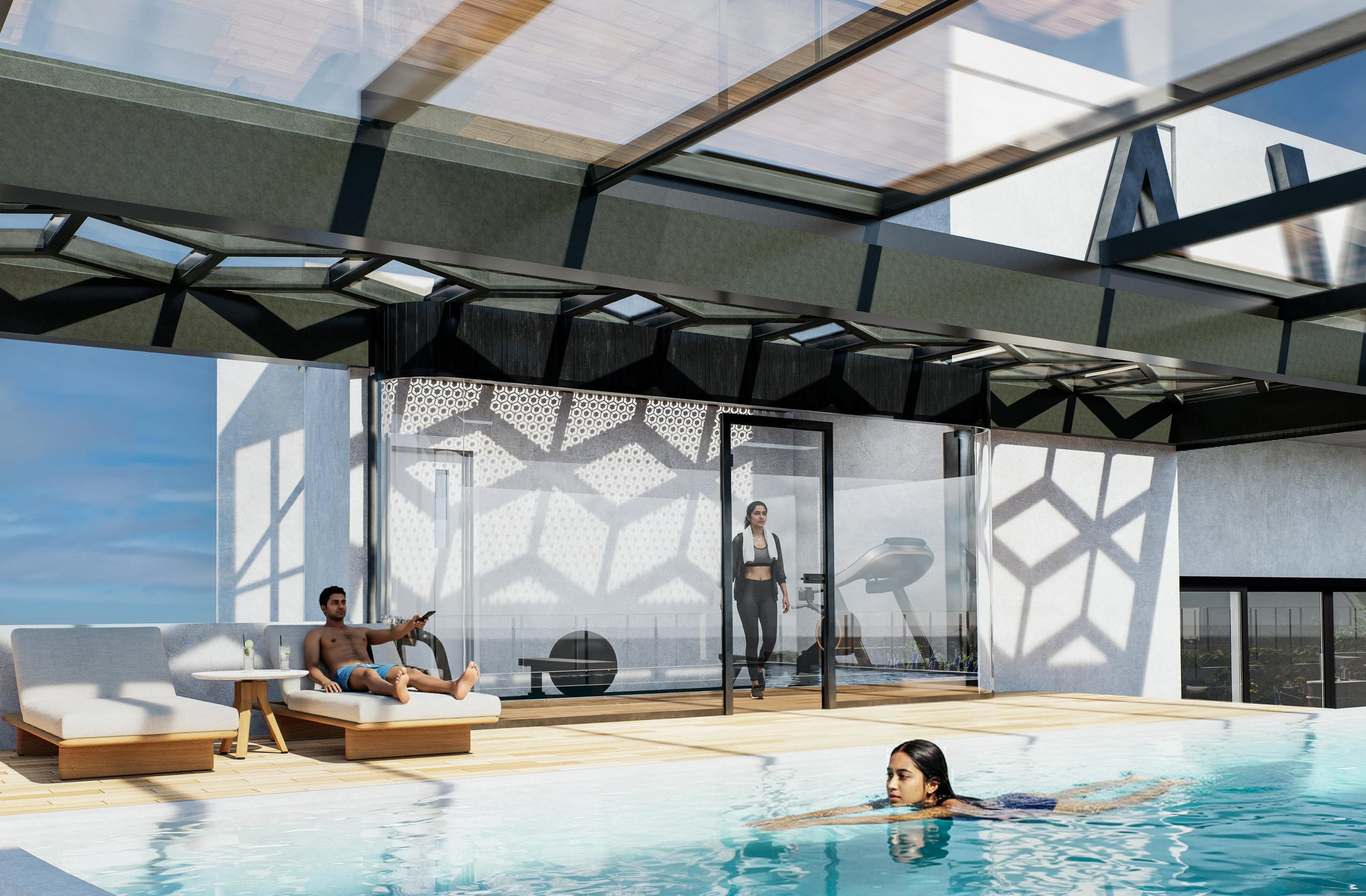 A woman swimming past the timber deck with loungers, and the curved glass gym with a woman walking out, under the lattice roof.
