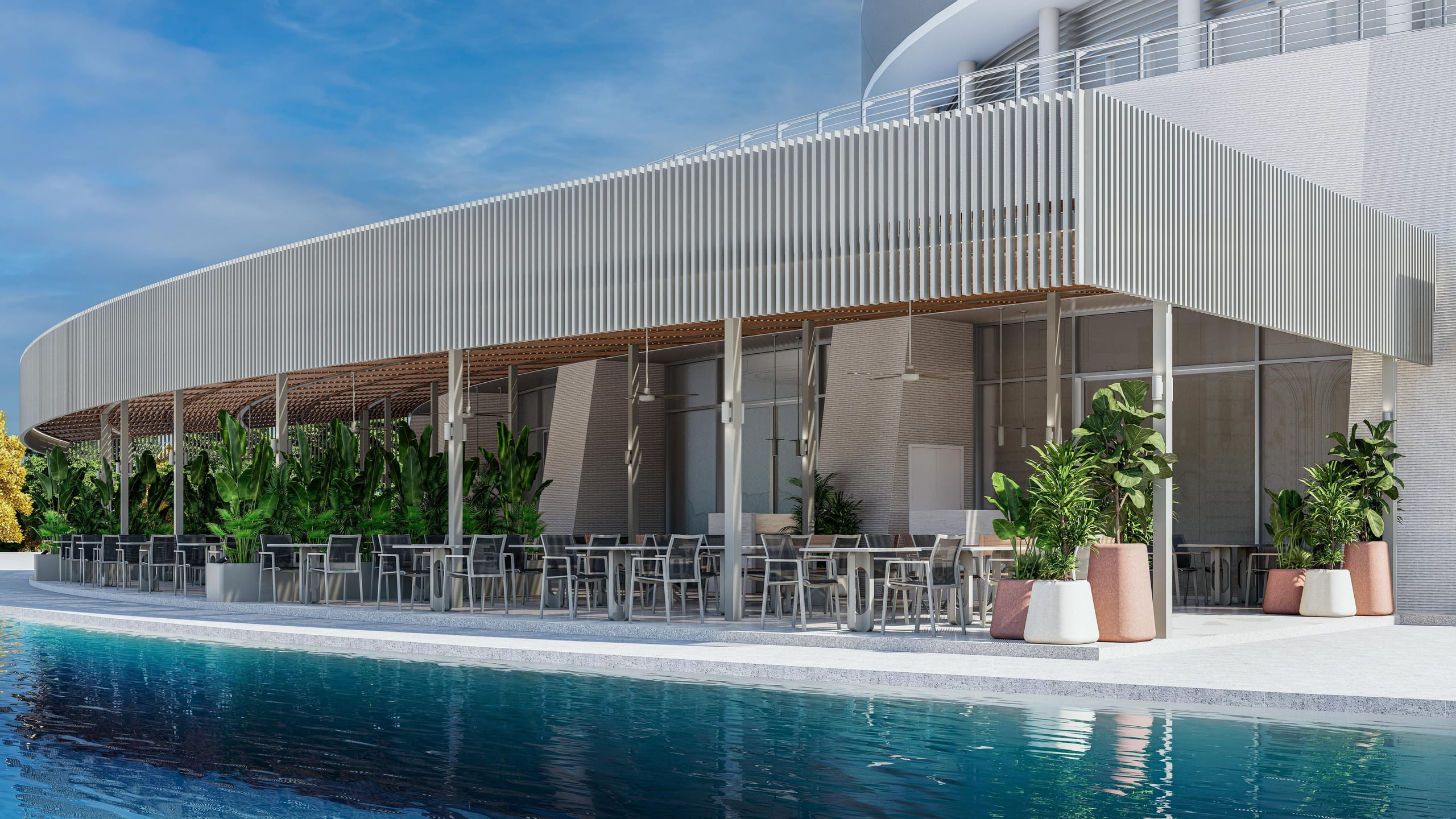 The curved slatted canopy of the restaurant terrace running along the pool.