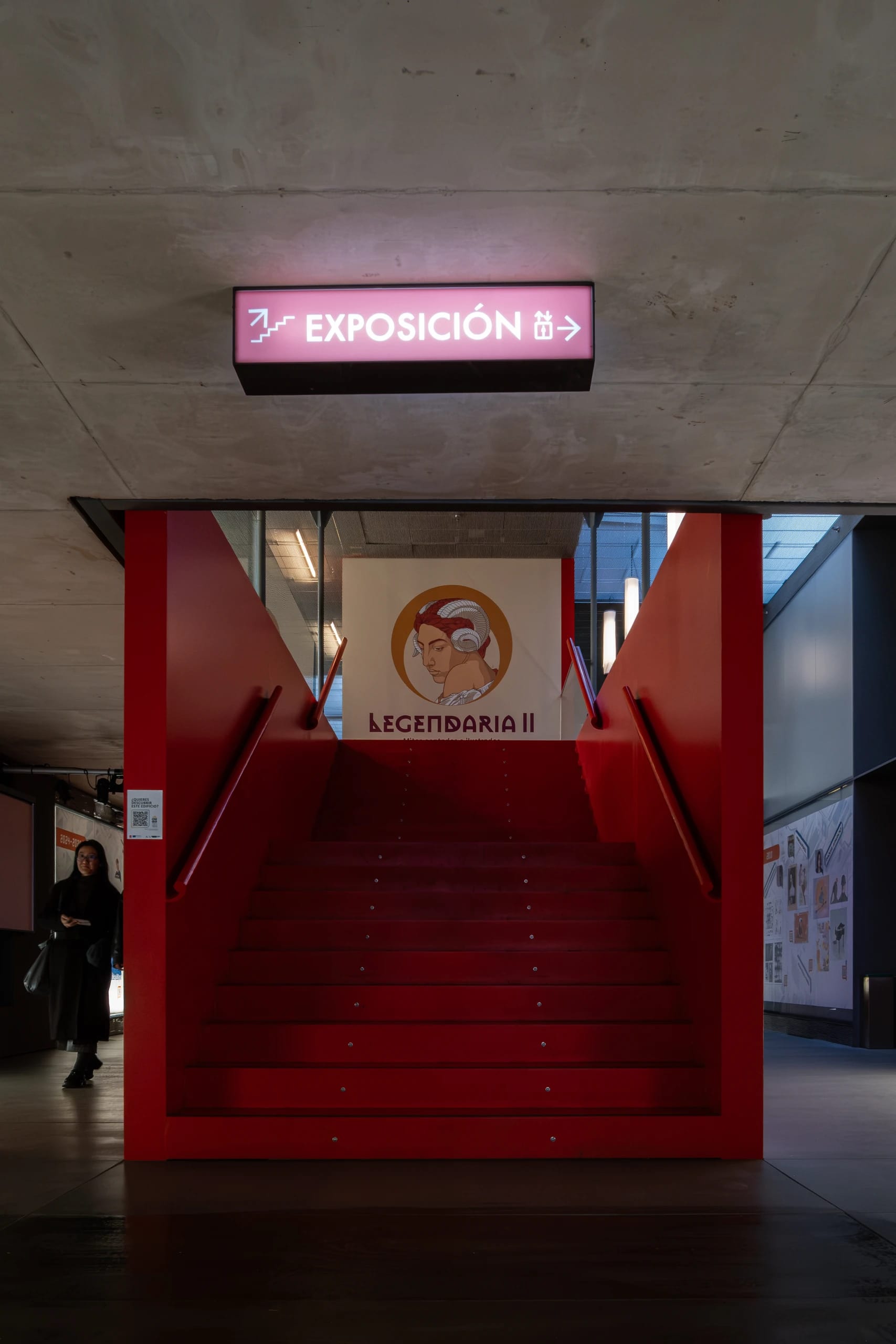 Red stairs leading to an exhibition
