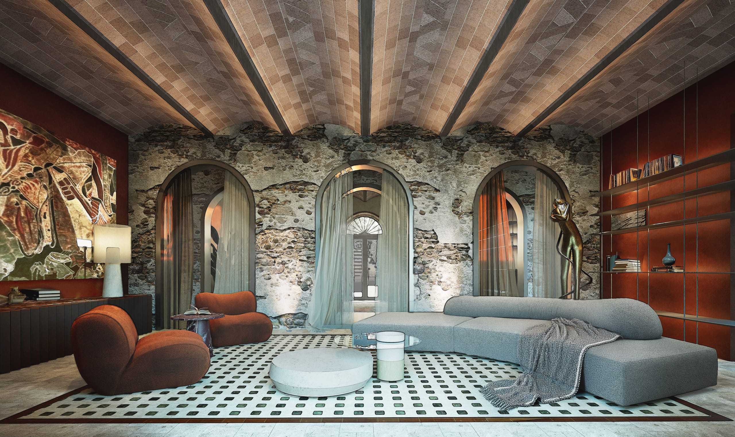 Living room under a vaulted brick ceiling with dark beams, an exposed rubble stone wall with three arched curtained openings, rust-coloured armchairs, a curved grey sofa, red walls with shelving and a large painting.