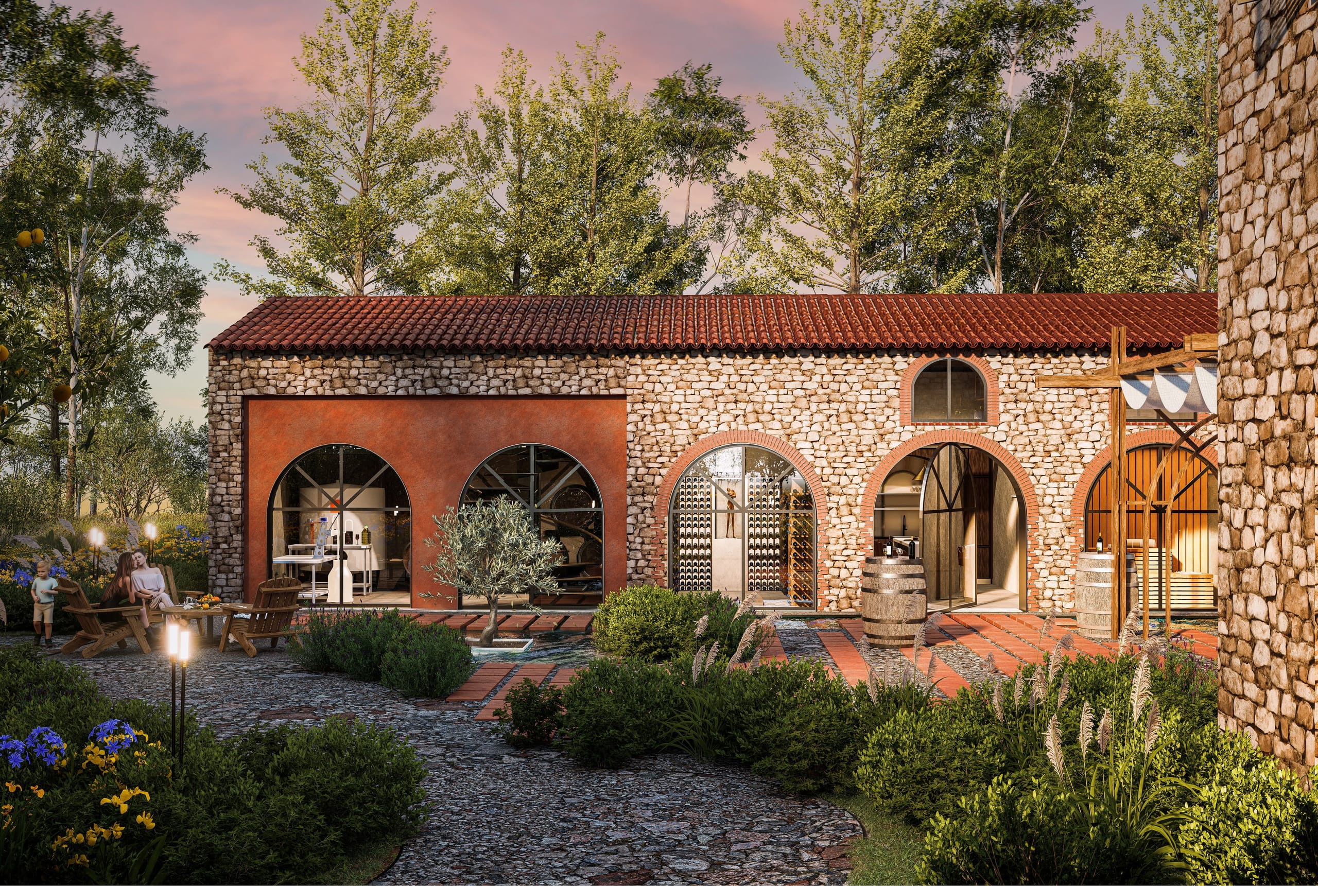 Dusk view of the stone rustico with its red plastered winery wall and arched glazed openings onto the wine cellar, with a family relaxing on wooden chairs and torches along the cobbled path.