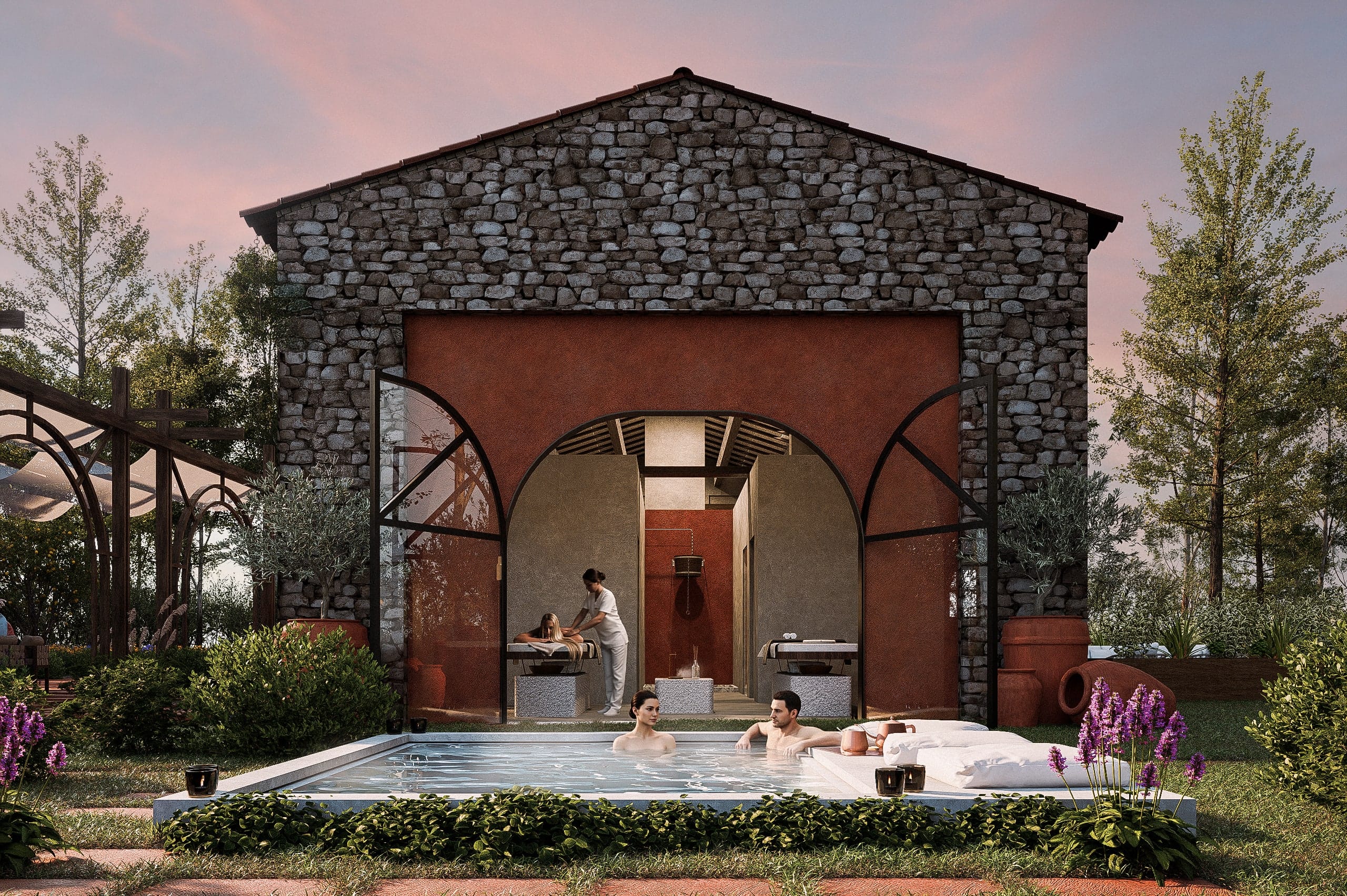 Stone spa building with a red arched opening onto a massage room, and a couple in a small outdoor pool in front among lavender.