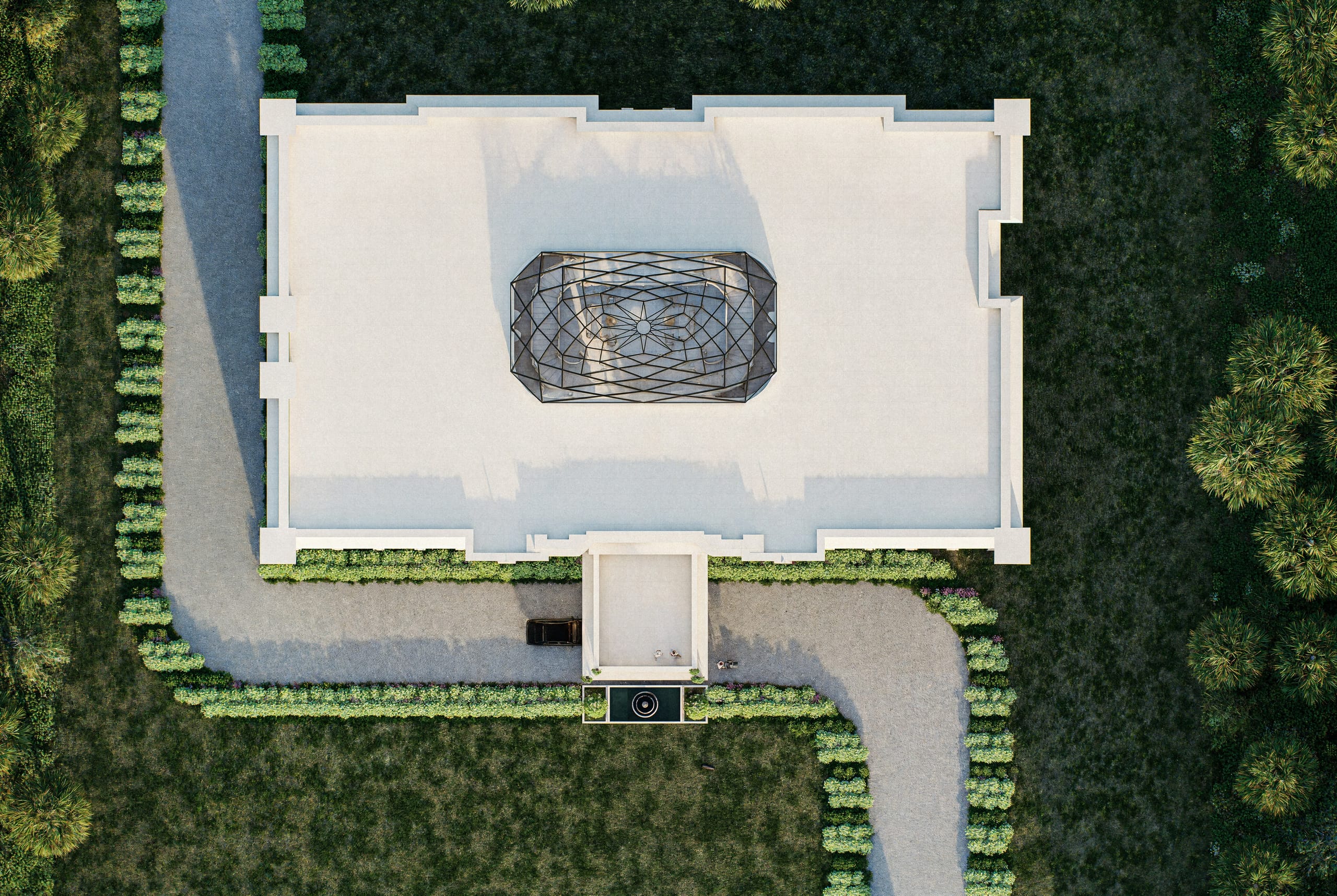 Top-down view of the flat roof with the elongated glass skylight showing the star pattern of the atrium floor below, and the drive and hedges around.