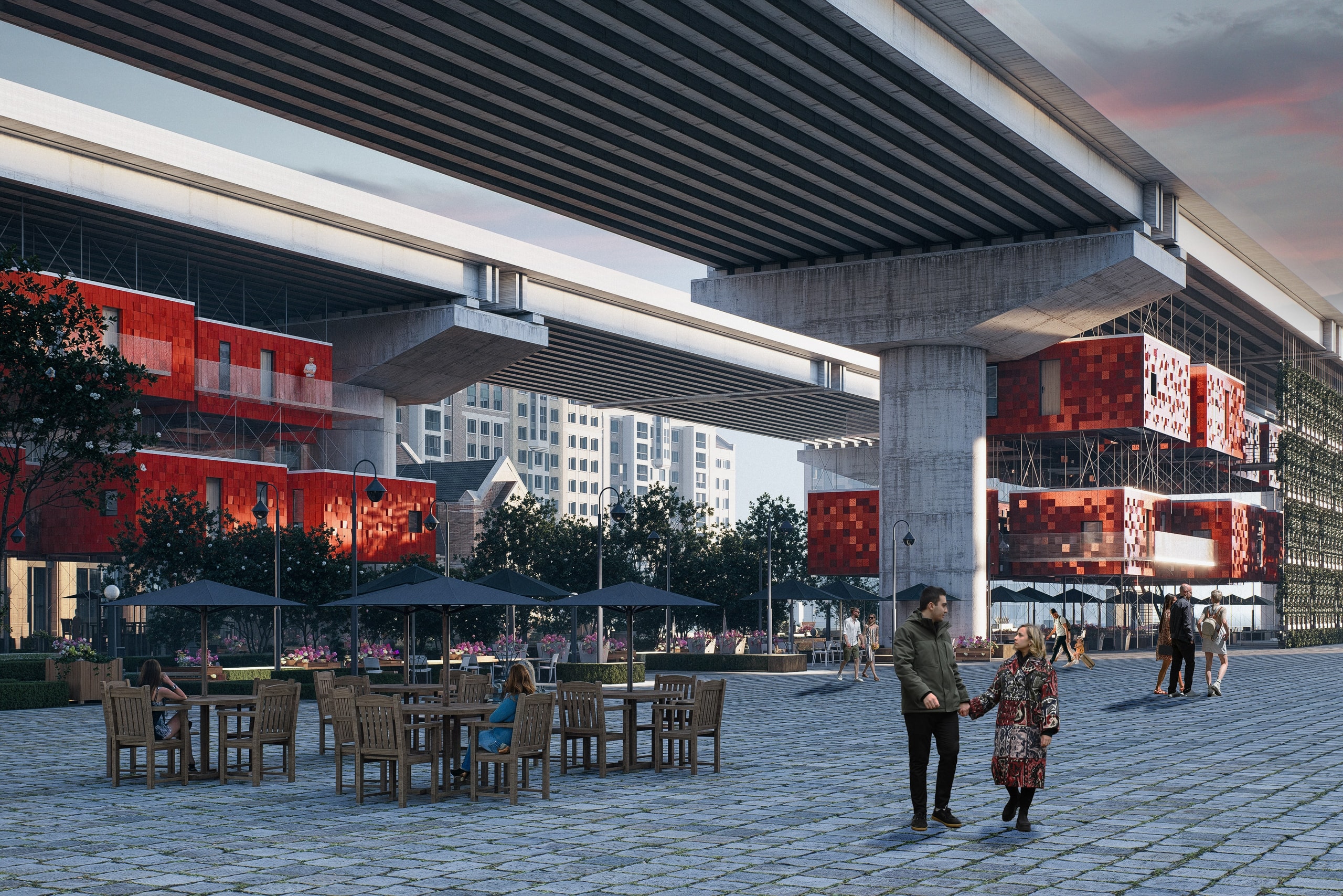 Cobbled plaza beneath a concrete viaduct, with red-clad timber housing modules hung from the viaduct beams on steel cables, café tables and umbrellas, and people walking past